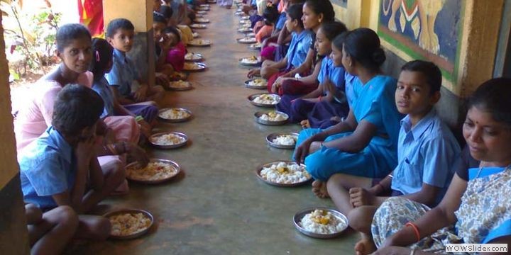 Children enoying a day's meal with parents