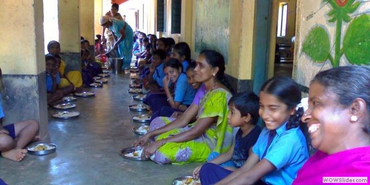 Children enoying a day's meal with parents