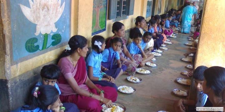 Children enoying a day's meal with parents
