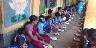Children enoying a day's meal with parents